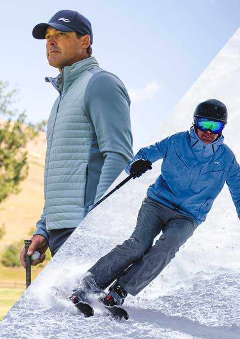 A man stands holding a golf club, gazing into the distance, wearing a cap, padded vest, and gloves with a hilly landscape behind him. A skier wearing a 
 KJUS ski jacket riding down the mountain.